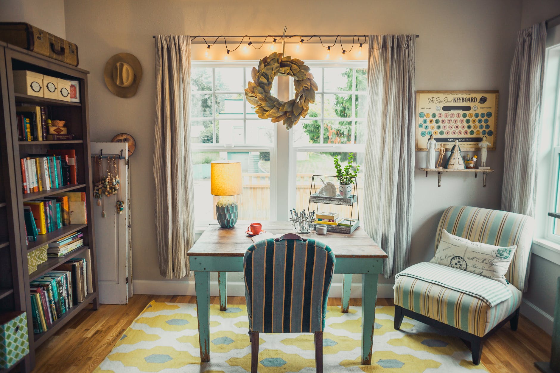 beige table lamp on table with chair in room